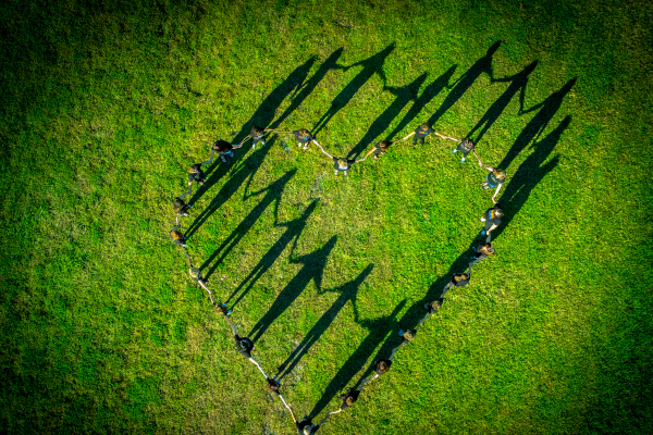 Holding hands in the shape of a heart